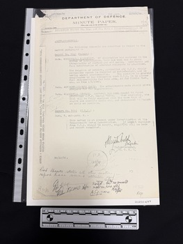 Foolscap copy of a Defence department Minute Paper report with information on the source along the left hand edge.