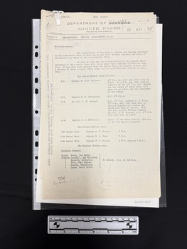 Foolscap copy of a multi-page Department of the Army Minute report with information on the source along the left hand edge.  Document held together with white archival paperclip.