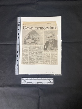 A newspaper clipping of a story of five columns of text beneath two black and white photos