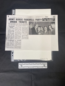 A newspaper clipping from a larger page, consisting of three columns of text next to a black and white photo