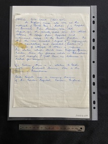 Handwritten short biography in blue ink on a lined piece of notepaper. There are two old stickytape marks on the left hand side.