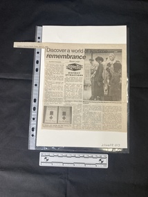 A newspaper clipping consisting of four columns of text and two black and white photos
