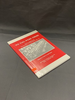 Red cover with a grey strip across the top and bottom. There is a black and white image of nurses in uniform marching along a street lined with crowds of people, in the centre. The title and editor details are printed in white text. There is a bright orange sticker around the bottom of the spine with B141 handwritten in black ink.