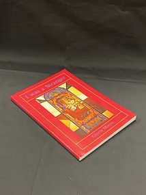 Red cover with blue text. An image of a stained glass window surrounded by a yellow line border with the titla above.