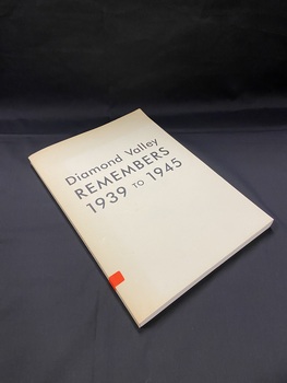 Cream coloured paperback book with the title printed across the front cover in black ink. The title is also printed in black ink along the spine. There is a small orange sticker on the lower part of the spine with B143 handwritten in black ink.