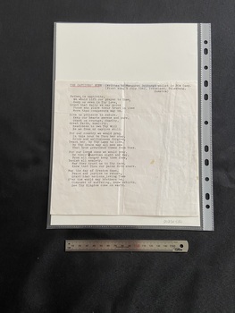 An A4 sheet of paper that has been cut down to a smaller size. The front contains the typed words of the hymn in black ink, the title in underlined in red pen ink. 