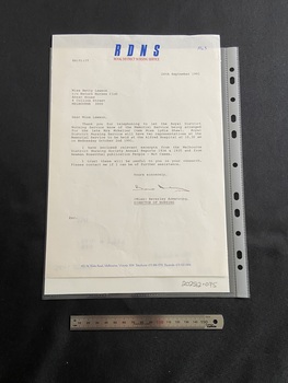 Typed letter on A4 paper. The typing is in black ink. There is a header at the top of the page with the letters RDNS printed in blue ink and beneath that 'ROYAL DISTRICT NURSING SERVICE' in red ink. At the bottom of the page are the contact details for the RDNS printed in blue ink.
