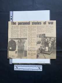 A large newspaper clipping consisting of five columns of text and two black and white photos