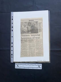 A newspaper clipping of three columns of text with a black and white photo above