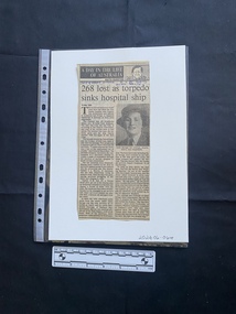 Newspaper clipping with column title, drawing of column author, article title, two columns of text and a photo embedded in one of the text columns.