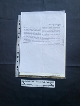 A photocopy of a small newspaper clipping consisting of a title and two columns of text