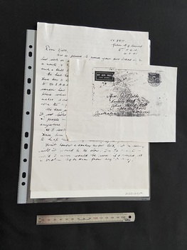 Photocopied pages of a handwritten letter and an addressed air mail envelope with postage marks.