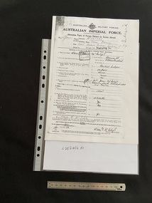 Australlian Military Forces is printed across the top with their emblem in the centre. Below in bold text is 'Australian Imperial Force'. The form covers the rest of the page asking for personal details such as name and unit, follwed by a series of questions, all of which is typed. The answers and signatures are all handwritten.