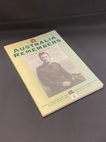 Yellow blending in to a green cover towards the right. Large black and white photographic image of a soldier in uniform in the centre. The top of the photo is printed 'the Shire of Campaspe recalls'. At the top of the cover is an Australia Remembers emblem and title in large green text. Below the photo, at the bottom of the page, is the remaining title and author details, between the two is the emblem fo rthe Shire.