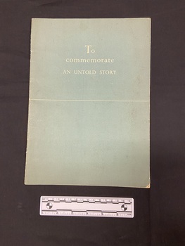 Illustrated booklet with blue-grey cover. Title printed in white on front and a straight white line printed horizontally across the middle of the cover.