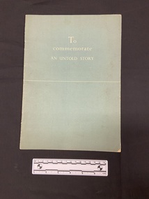 Illustrated booklet with blue-grey cover. Title printed in white on front and a straight white line printed horizontally across the middle of the cover.