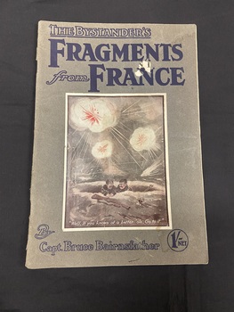 Booklet with an olive green-grey coloured cover and two staples in the spine. Title printed across the top in blue print. Large cartoon drawing of two soldiers in a trench with bombs exploding above them surrounded by a white rectangle border. Author's name printed across the bottom.