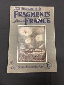 Booklet with an olive green-grey coloured cover and two staples in the spine. Title printed across the top in blue print. Large cartoon drawing of two soldiers in a trench with bombs exploding above them surrounded by a white rectangle border. Author's name printed across the bottom.