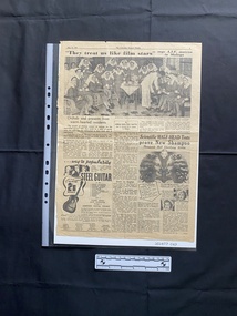 A large newspaper page featuring a large black and white group photo above a related story and ads