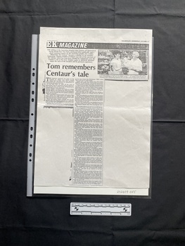A large photocopy of a magazine article with a small black and white photo in the top left corner and two columns of text