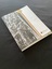 Paper folio cover depicting a photo of soldiers with their heads down disembarking a ship. The image appears like a photo on brown backing card and the remaining cover is white. The title is printed across the bottom.