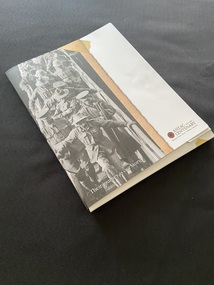 Paper folio cover depicting a photo of soldiers with their heads down disembarking a ship. The image appears like a photo on brown backing card and the remaining cover is white. The title is printed across the bottom.
