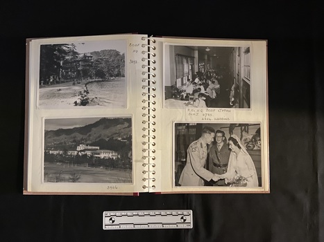 An example of the open page layout, showing the spiral binding and multiple black and white photographs under the plastic protector sheets.