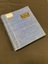 Blue woven covered photograph album with a black plate attached to the upper right cover that reads photo album in gold lettering and an onate pattern below the words (plate measures 1x3inch). A white label is attached to the top left corner with WWI and II inscripted on it.