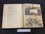 An example of the open album displaying a copy of a typed poem on the left side page and four photographs laid out on the right side page. There are two photos at the top, one below them with writing on either side, and a larger photo at the bottom.