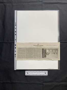 A newspaper clipping consisting of the title, three columns of text and a black and white photo