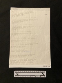 Poem typed in black ink on an A4 page with some small annotations in blue biro ink. There are crease marks where the page has been folded in four and a small tear on the centre right side edge.