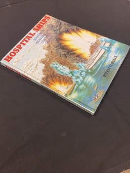 Gloss hard cover, no book jacket with illustration of ships under attack and the title printed in bold red type across the top.