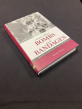 Maroon and white dustjacket with a black and white image of eight nurses at the top and a white text box below with the title printed in black and maroon.