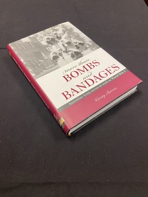 Maroon and white dustjacket with a black and white image of eight nurses at the top and a white text box below with the title printed in black and maroon.