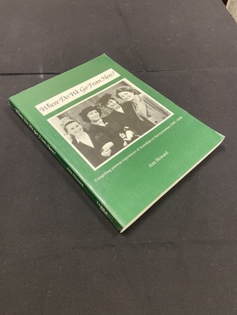 Green paperback cover with white printed title on the spine. White text box on the cover with title printed inside it in black. Photograph of four women on the cover in black and white.