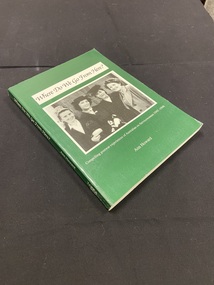 Green paperback cover with white printed title on the spine. White text box on the cover with title printed inside it in black. Photograph of four women on the cover in black and white.