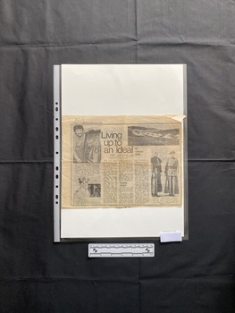 A newspaper clipping that includes a title, captions, three columns of text and four black and white photos