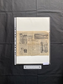A newspaper clipping that includes a title, captions, three columns of text and four black and white photos