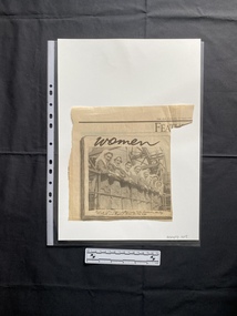 A newspaper clipping of a large black and white photo with a caption beneath