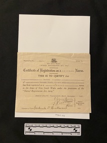 Certificate printed on cream coloured paper. There is an emblem at the top and below it reads 'New South Wales Nurses Registration Act, 1924'. The name and date have been typed in and it has been hand-signed.