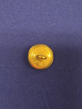 Reverse of button showing shank and 'STOKES & SONS' makers' mark.