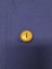 Reverse of brass Royal Australian Airforce button with engraved makers mark and metal shank. 