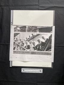 A photocopy of a newspaper clipping of a large black and white photo
