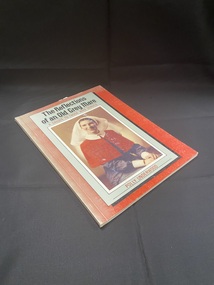 Paperback with faded cover. Plain white spine with a red front cover. Most of the cover contains a large pale green rectangle with a shadow behind it, inside it is the title and author details and a picture of an Army Nurse in uniform.