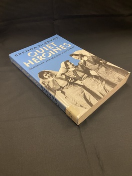 Blue paperback book with a black and white image of three nurses happily walking arm in arm. The title appears in white print, the author and sub title are printed in black.