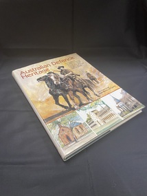 Hardcover book with dust jacket. Title at the top of the cover and along spine. There is a drawn image of three soldiers riding on horseback. Across the bottom of the front cover are three images of different buildings.