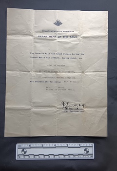 Off white certificate regarding world war two service and war medals 