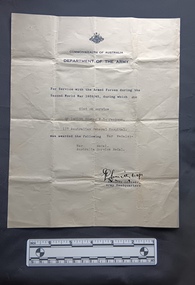 Off white certificate regarding world war two service and war medals 