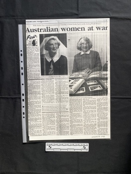 A photocopy of a large magazine clipping, consisting of a title, two large photos and six columns of text
