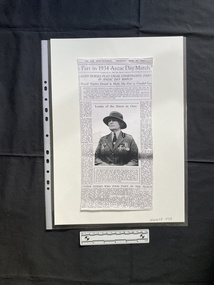 A photocopy of a newspaper clipping consisting of titles, one large photo and several columns of text
